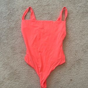 Brand new Skims neon orange bodysuit. Never worn